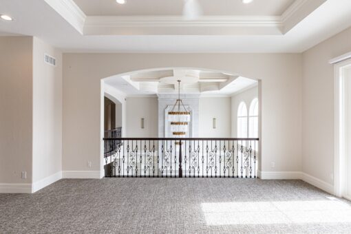 Prescott loft overlooking the foyer with iron railing