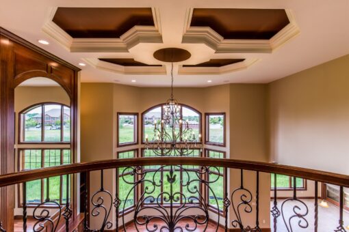 Richland loft with coffered ceiling and iron railing