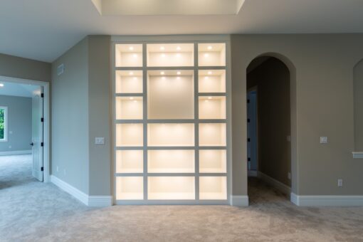 Kingfogl custom home loft with lit built-in display shelving