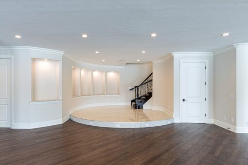 Prescott lower level with staircase and lit wall niches