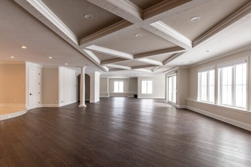 Prescott lower level with coffered ceiling and hardwood floors