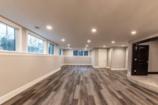 Kingfogl custom home lower level with wide-plank floors and egress windows
