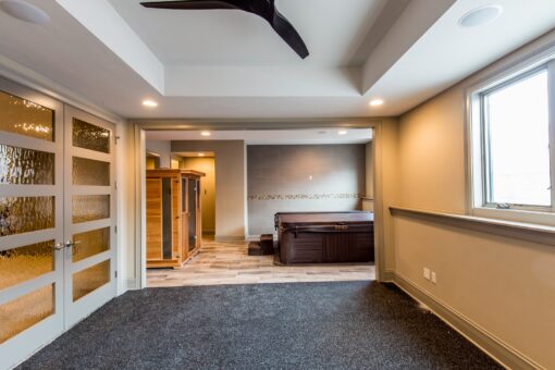 Compton lower-level room with tray ceiling