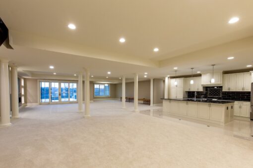 Vizzini lower-level open space with columns and walk-out windows