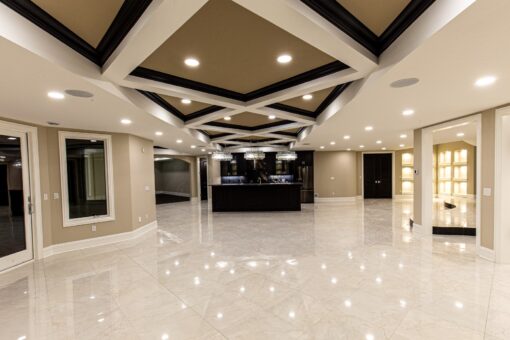 Saddlebrook lower-level bar beneath a coffered ceiling