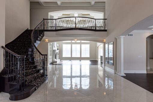 Prescott curved staircase and balcony overlooking the great room