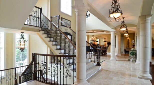 Buckingham foyer staircase with wrought-iron railing and columns