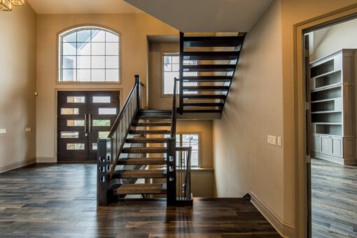 Compton open-riser staircase and front windows