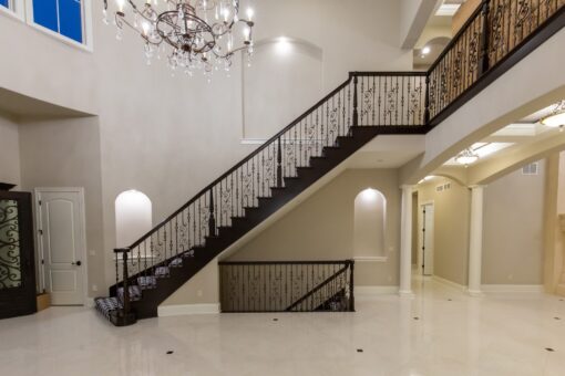 Vizzini floating staircase with wrought-iron railing