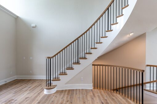 Oriole curved staircase with wood railing