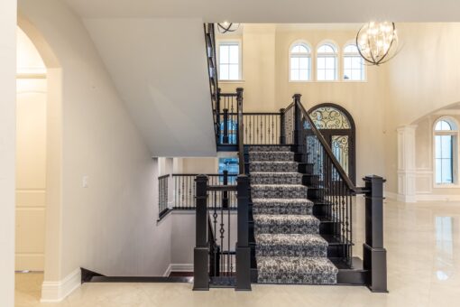 Davidson foyer staircase with patterned carpet runner