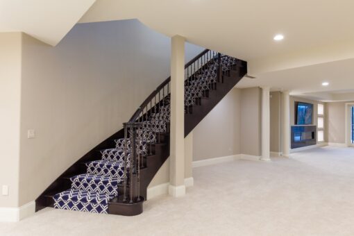 Vizzini staircase with patterned runner to the lower level