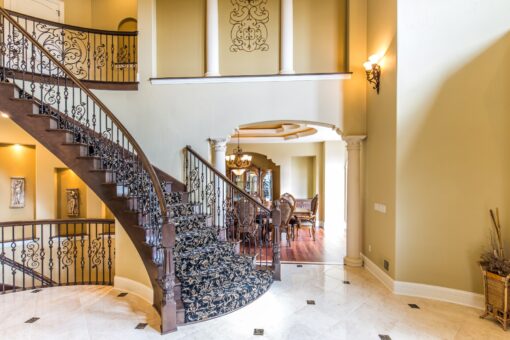 Brandywine curved staircase with iron railing