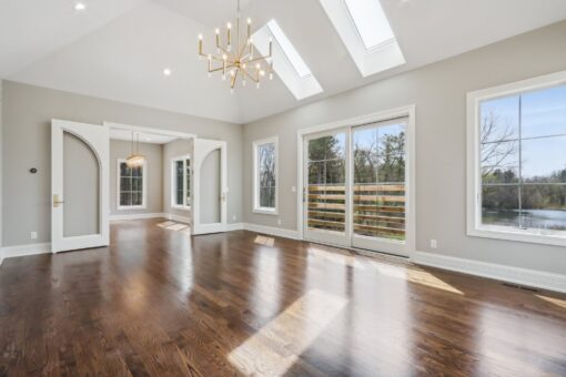 Rangeline hearth room with vaulted ceiling and skylights