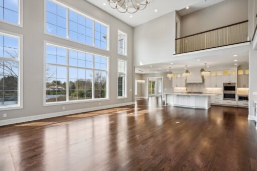 Rangeline two-story great room with window wall and balcony