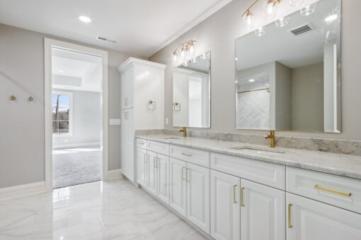 Rangeline primary bath double vanity with gold hardware