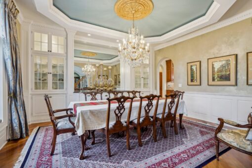 Danbury dining room with crystal chandelier and tray ceiling