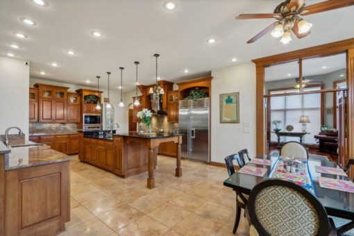 Danbury kitchen with wood cabinetry and granite island
