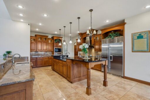 Danbury kitchen with two islands and wood cabinetry