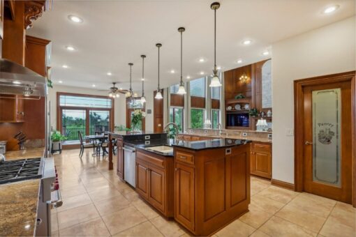 Danbury kitchen with granite island and pendant lights