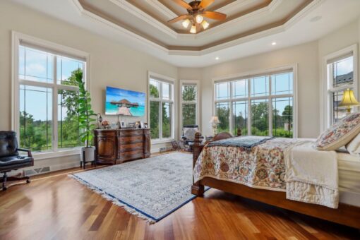 Danbury primary bedroom with tray ceiling and bay windows