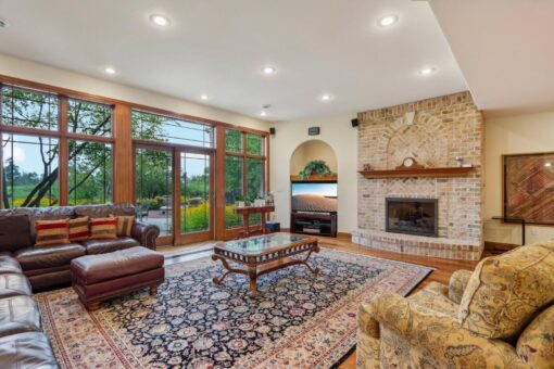 Danbury lower-level family room with stone fireplace