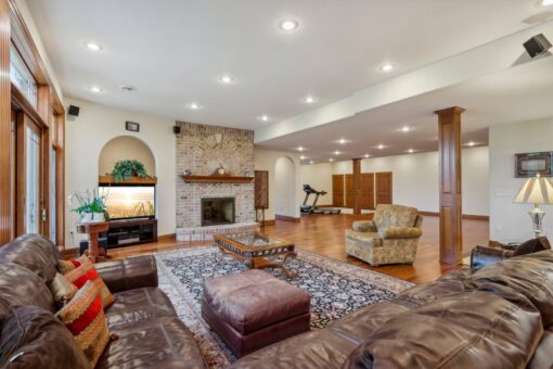 Danbury lower-level stone fireplace and lounge