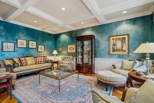 Danbury living room with teal walls and coffered ceiling