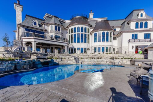 Gatsby pool and spa terrace below the curved rear elevation