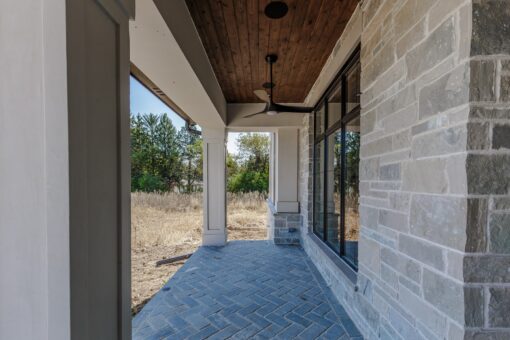 Ridge covered rear patio with wood ceiling