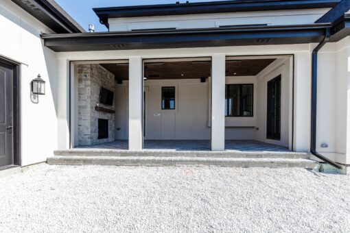 Ridge covered outdoor living area with fireplace