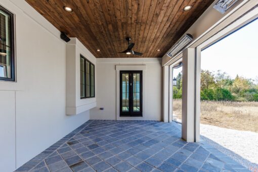Ridge covered patio with French doors and wood ceiling