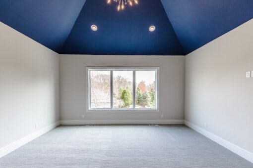 Settlers Circle bedroom with navy vaulted ceiling
