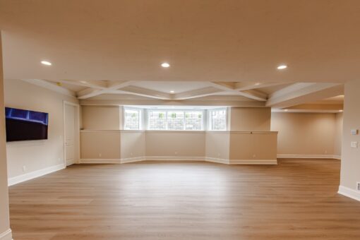 Settlers Circle lower-level room with coffered ceiling