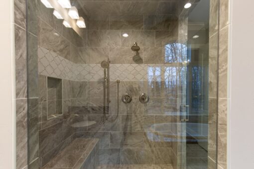 Woodview double walk-in shower with stone tile