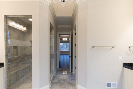Woodview bathroom with view through to the bedroom