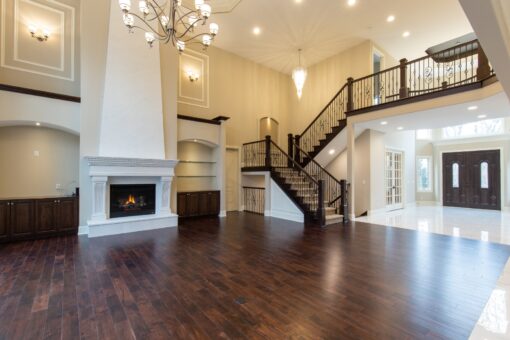Woodview great room with fireplace and open staircase