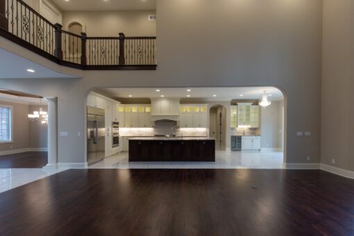 Woodview kitchen viewed from the great room beneath the balcony