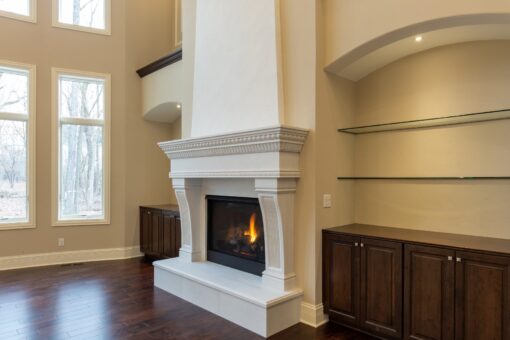 Woodview cast stone fireplace and built-in cabinetry
