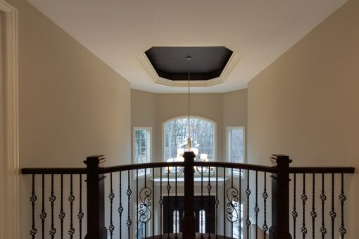 Woodview balcony overlooking the foyer with tray ceiling