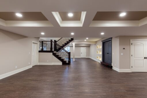 Woodview lower level with coffered ceiling and staircase