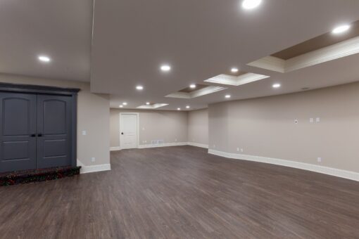 Woodview lower level with dark doors and open space