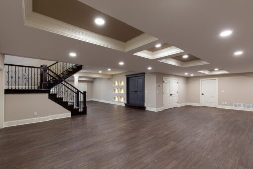 Woodview lower level with staircase and lit niches