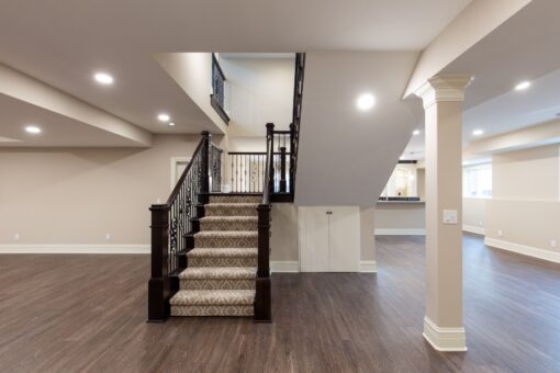 Woodview staircase with carpet runner to the lower level