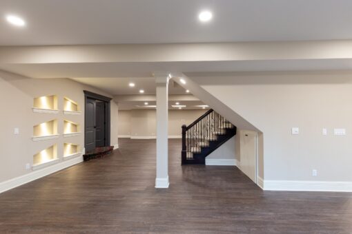 Woodview lower level with lit niches and column
