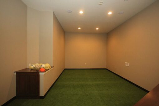Kingfogl custom home home turf training room with artificial grass