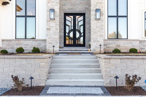 Carlisle front entry steps and modern iron and glass doors