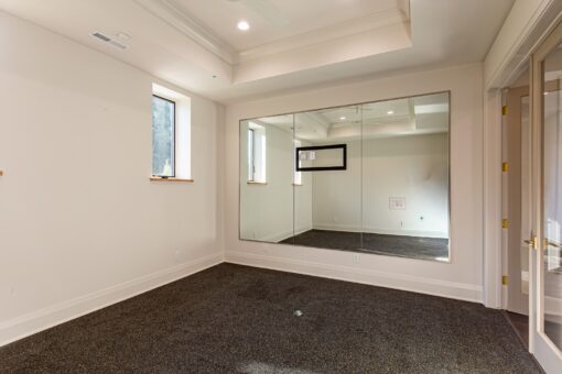 Carlisle lower-level exercise room with mirror