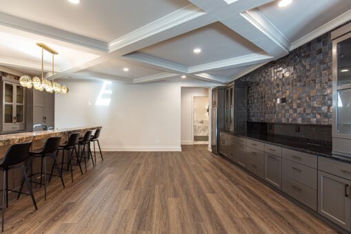 Carlisle lower level with coffered ceiling and bar