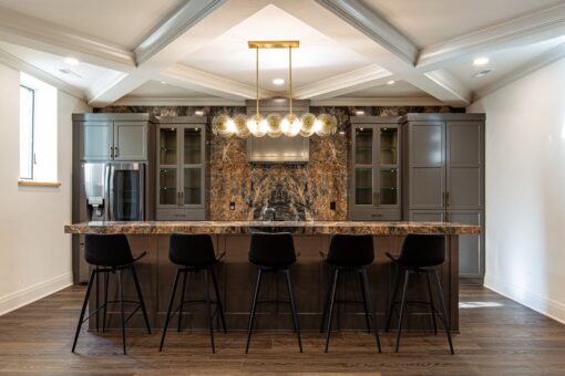 Carlisle lower-level bar with seating and pendant lights